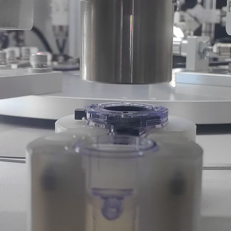 Automatic rear cap pressing process for laparoscopic trocar cannula