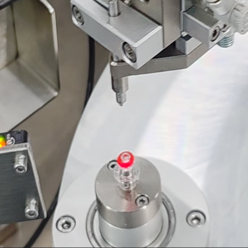 Close‑up view of assembly station for medical high‑pressure connector automation machine